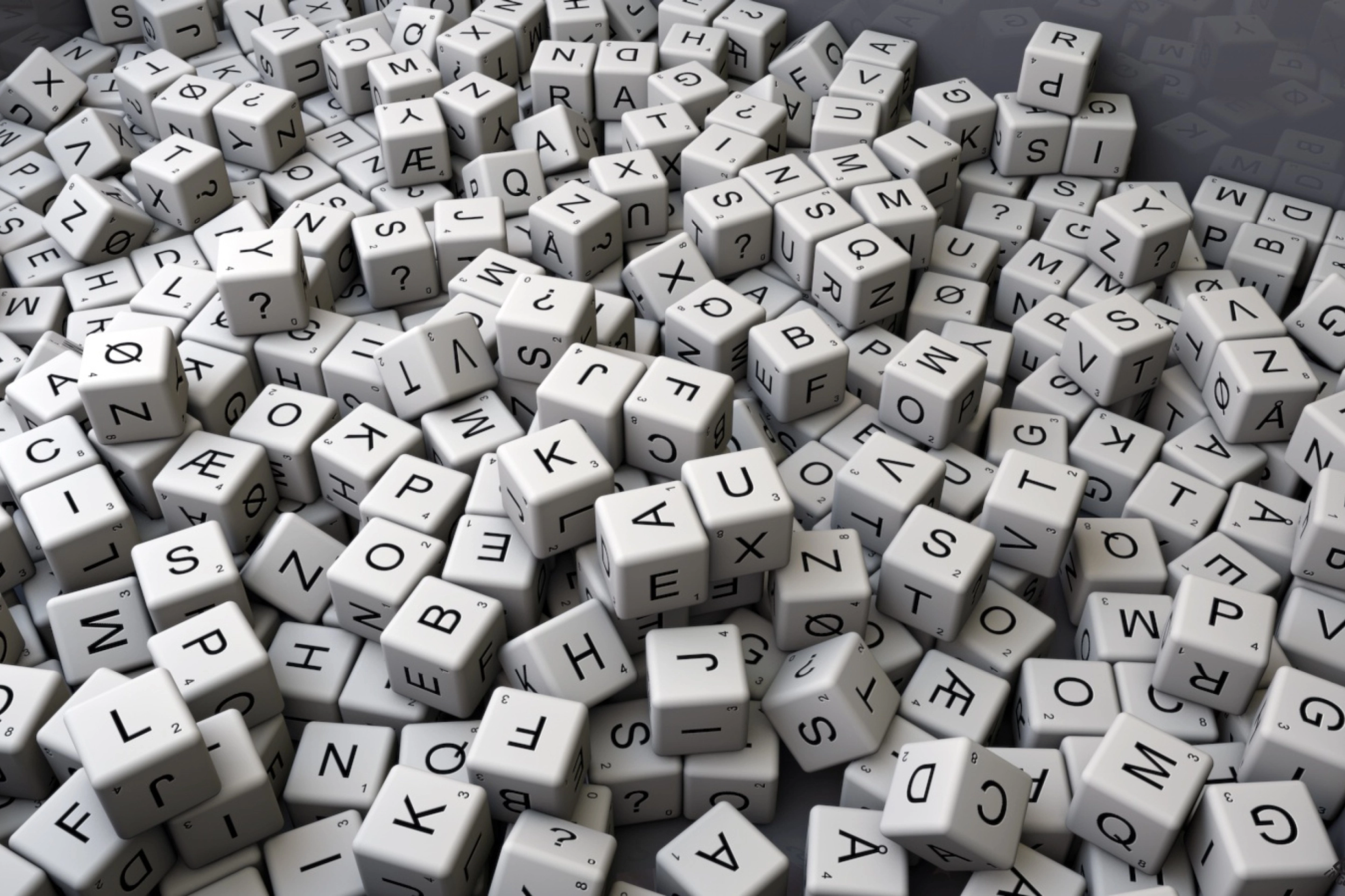 Champ de dés avec des lettres sur chaque face symbolisant la création littéraire et le processus d’édition.